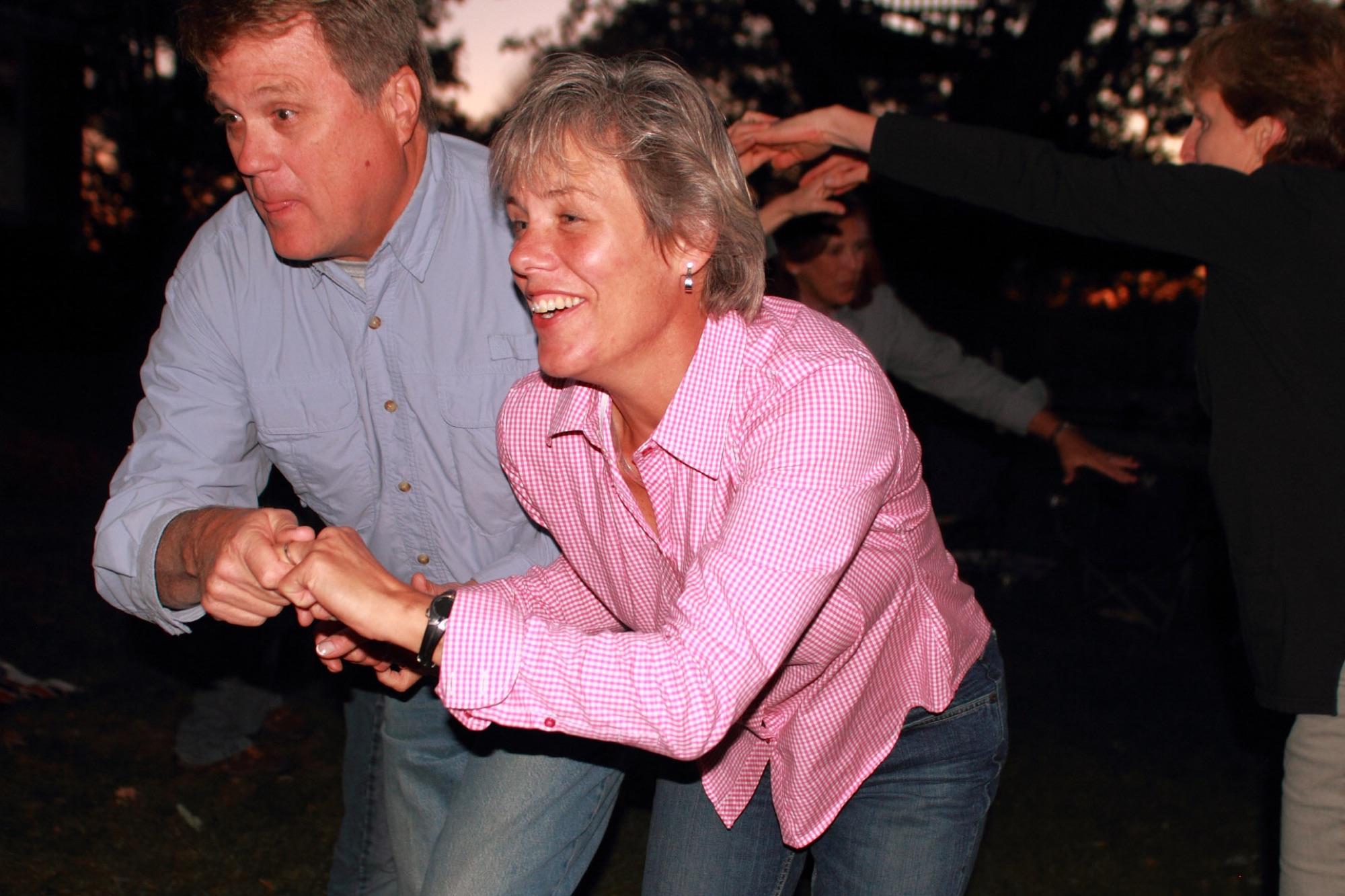 Couples dancing outdoors at a Trinity event