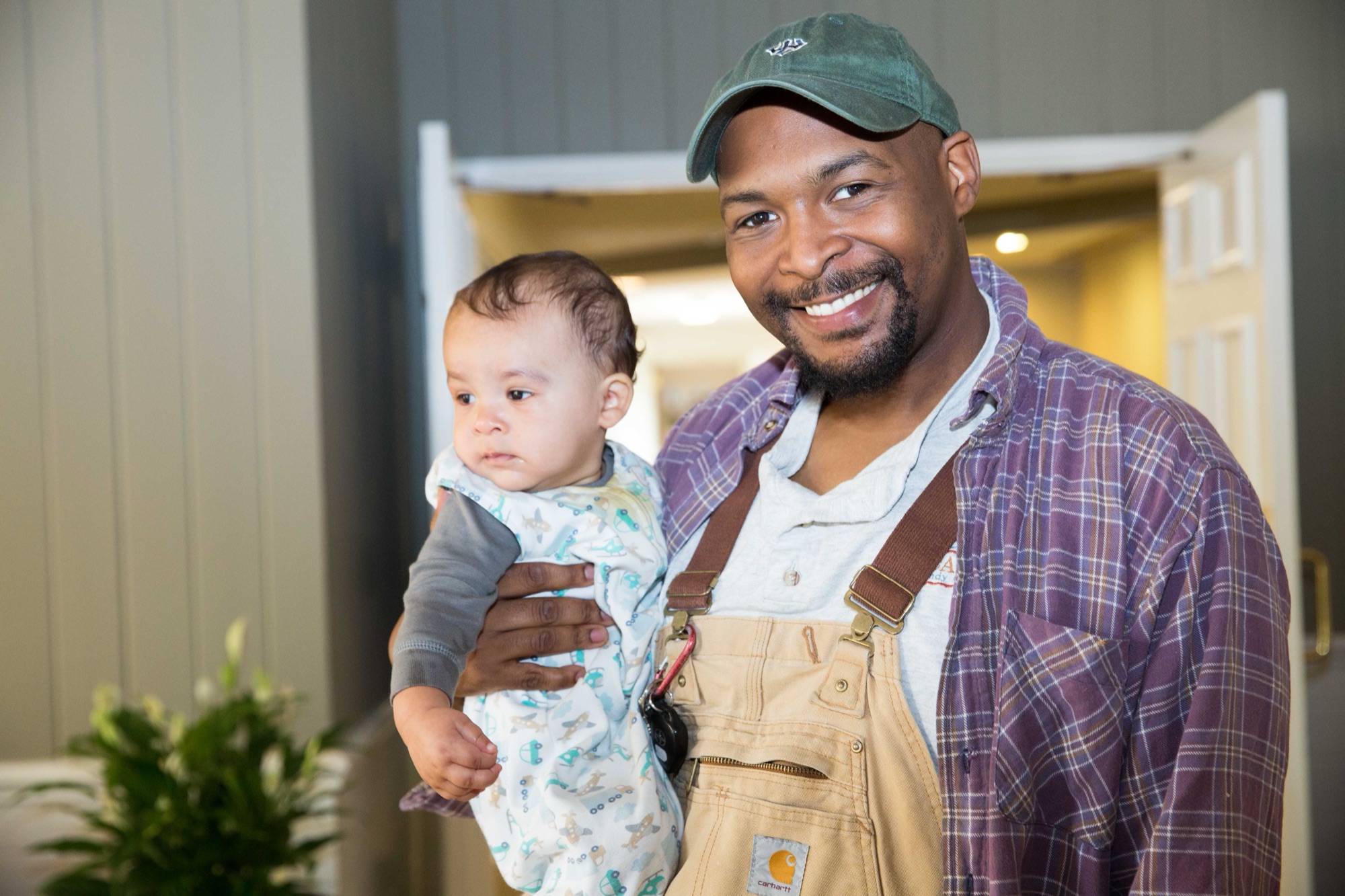 D.J. Carter holding his baby