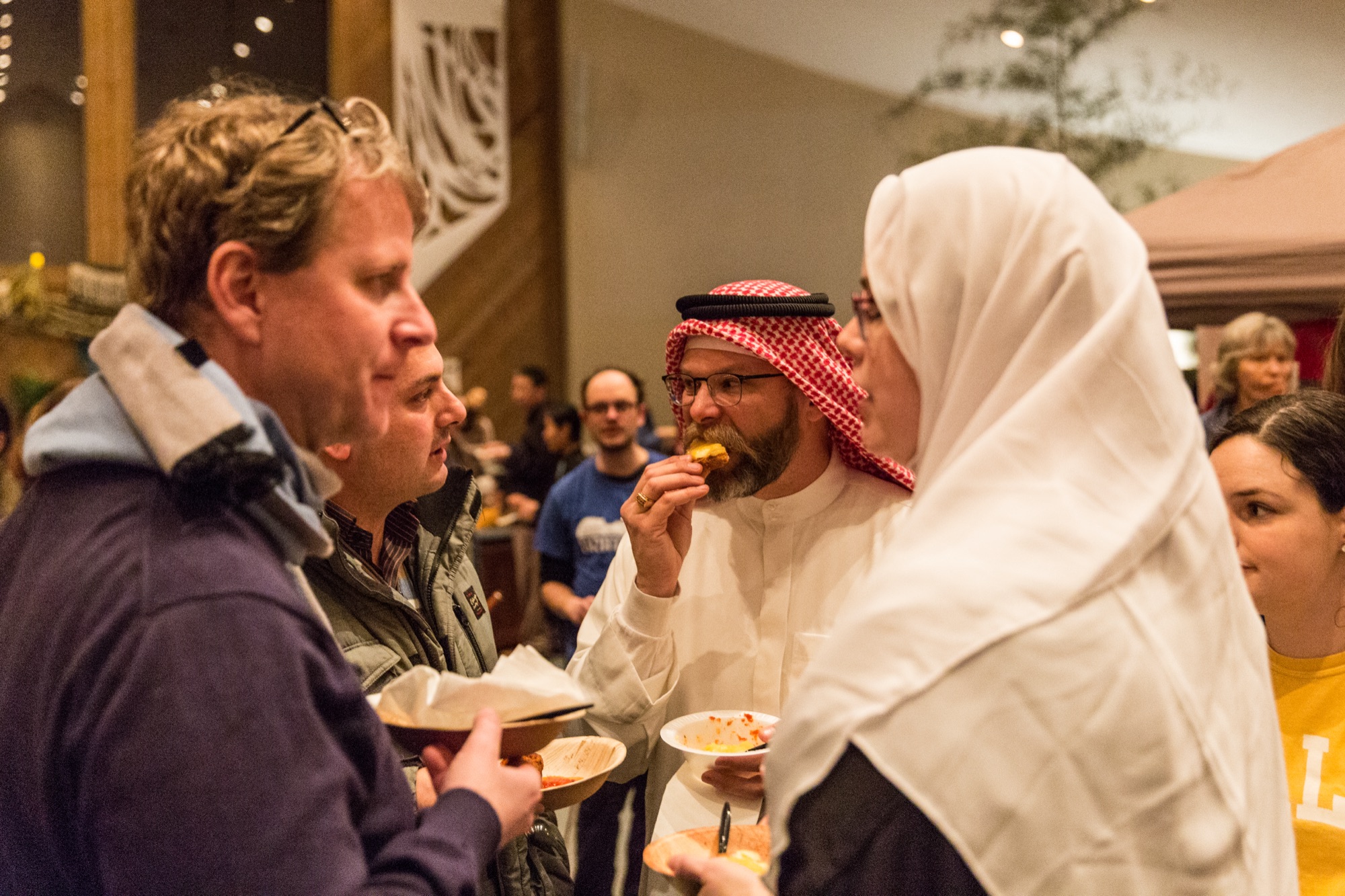 Guests sampling international food at Taste and See